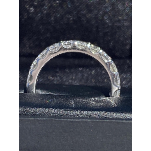 14 - A TIMELESS 18CT WHITE GOLD DIAMOND ETERNITY RING, the eleven round brilliant cut diamonds weight: 1.... 