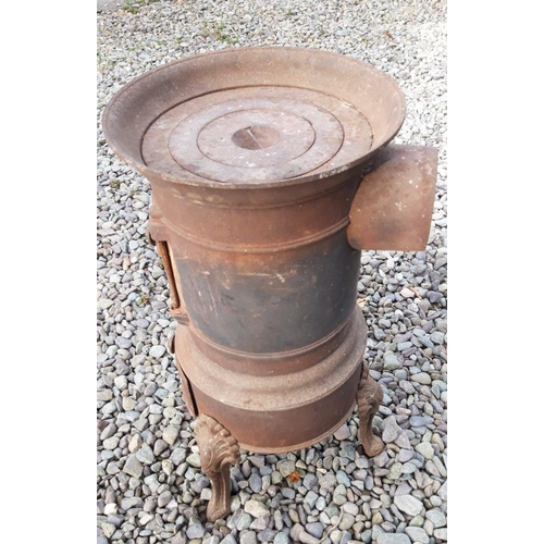 146 - AN ANTIQUE CAST IRON CIRCULAR COAL STOVE, Late 19th Century, with decorative handle, standing on cab... 