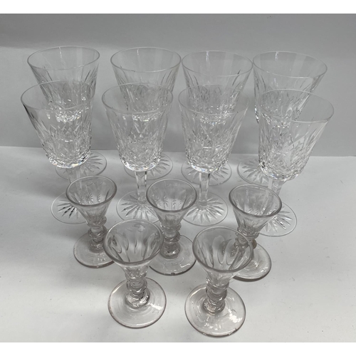 158 - A GLASS LOT TO INCLUDE eight cut glass wine glasses with star cut circular bases, along with five li... 