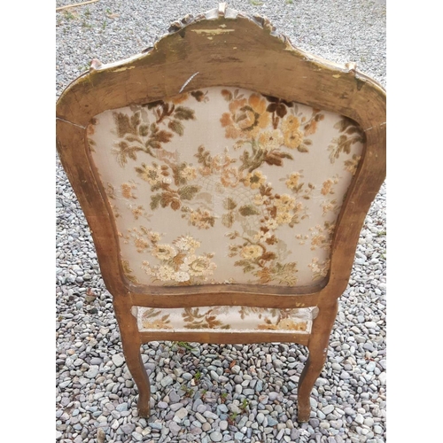 16 - AN ANTIQUE LOUIS XV STYLE ARMCHAIR, carved giltwood frame decorated with flowers, scrolls and shell ... 