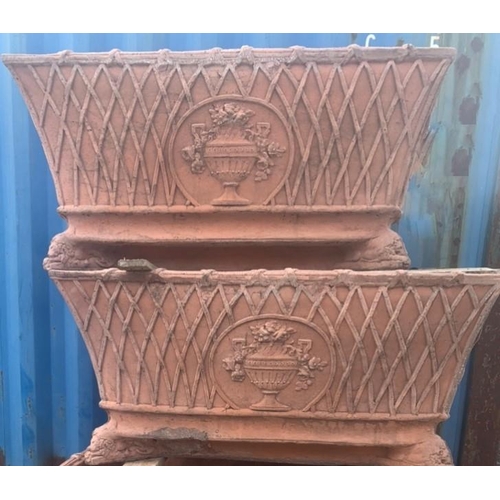 19 - A PAIR OF TERECOTTA GARDEN PLANTERS, rectangular form, with crosshatch design and central motif, sta... 