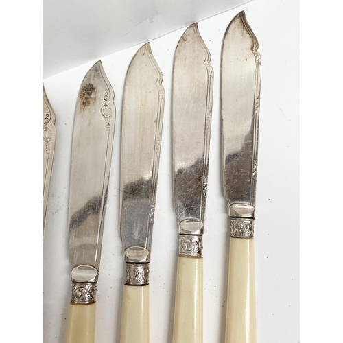 221 - AN ENGRAVED SILVER PLATED FISH KNIFE AND FORK SET, to include twelve knives, engraved design, with r... 