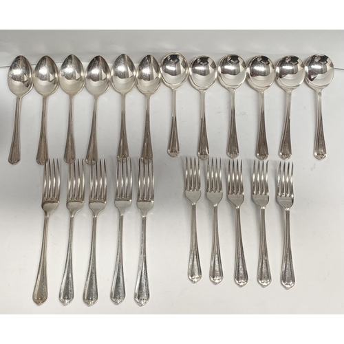 225 - A SILVER PLATED LOT TO INCLUDE (i) six table spoons, (ii) six dessert spoons, (iii) five large forks... 