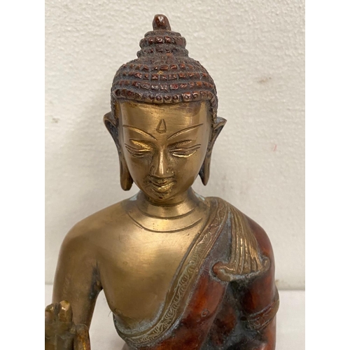 234 - A BRONZE FIGURE OF BUDDHA, in seated position with one palm upright and resting on the lap and the o... 