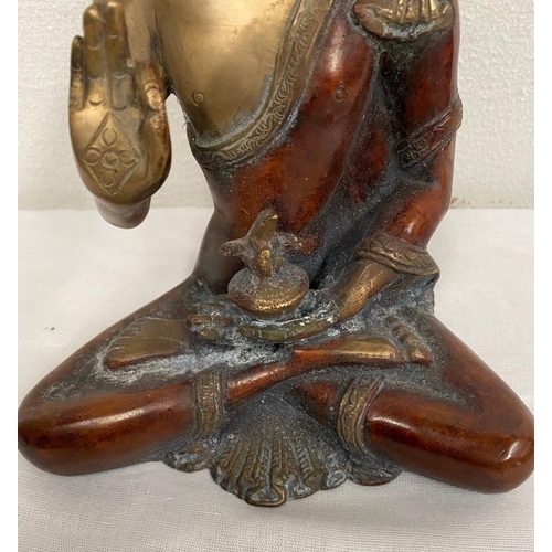 234 - A BRONZE FIGURE OF BUDDHA, in seated position with one palm upright and resting on the lap and the o... 