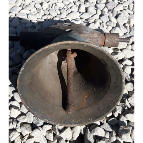 236 - AN ANTIQUE ESTATE BRONZE BELL, complete with wooden frame. Dimensions: 20cm high approx.