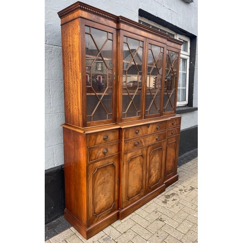 29 - A MAHOGANY BREAK FRONT SECRETAIRE LIBRARY BOOKCASE, with dentil cornice, architectural glazed doors ... 