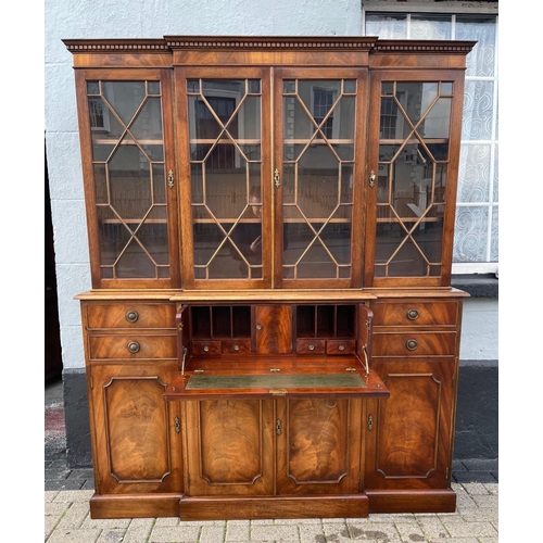 29 - A MAHOGANY BREAK FRONT SECRETAIRE LIBRARY BOOKCASE, with dentil cornice, architectural glazed doors ... 