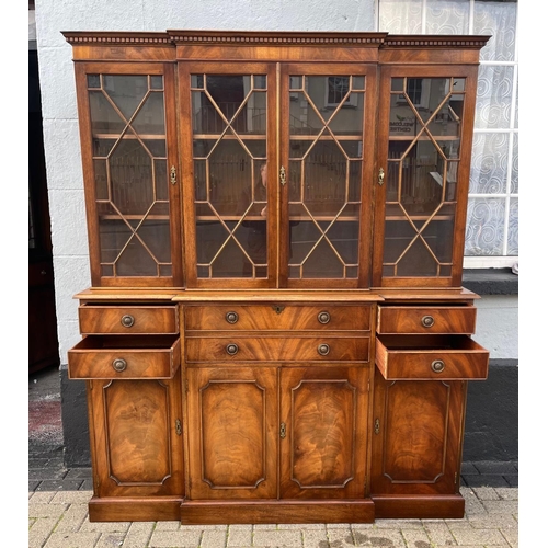 29 - A MAHOGANY BREAK FRONT SECRETAIRE LIBRARY BOOKCASE, with dentil cornice, architectural glazed doors ... 