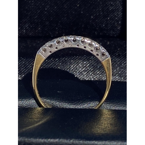 34 - A STRIKING 9CT YELLOW AND WHITE GOLD HALF ETERNITY DIAMOND RING, a very pretty design. Diamond weigh... 