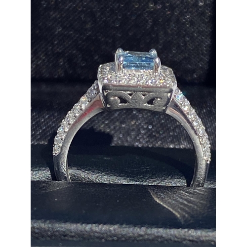 42 - AN ORNATE 18CT WHITE GOLD AQUAMARINE AND DIAMOND CLUSTER RING, emerald but aquamarine weight: 1.05ct... 