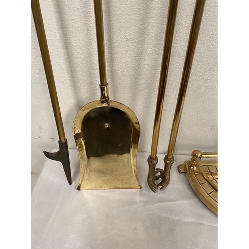 44 - A BRASS STAND WITH FIRE IMPLEMENTS, stand with shaped galleried base, includes shovel, poker and ton... 