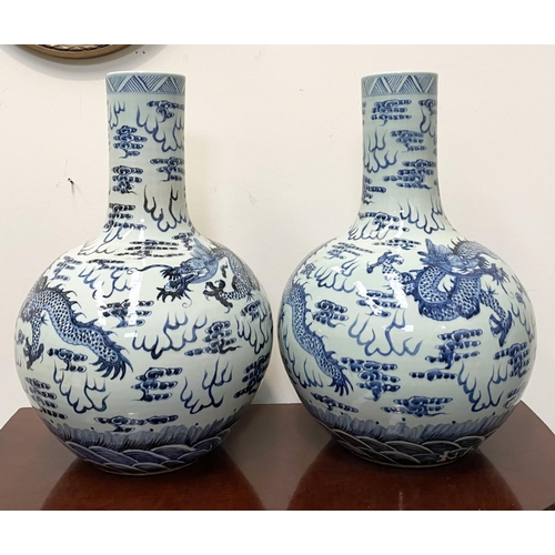 47 - A PAIR OF LARGE ANTIQUE CHINESE BOTTLE VASES, late 19th Century, baluster shape, decorated with pain... 