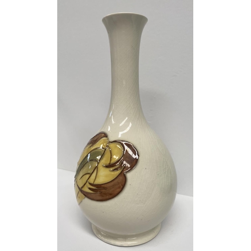 49 - A MOORCROFT POTTERY BUD VASE, in the tumbling leaves pattern, baluster form, with impressed and pain... 