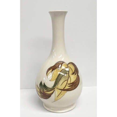 49 - A MOORCROFT POTTERY BUD VASE, in the tumbling leaves pattern, baluster form, with impressed and pain... 