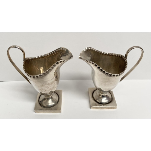 53 - A PAIR OF ANTIQUE CENTURY SILVER CREAM JUGS, Maker George Nathan & Ridley Hayes, Icknield Street & H... 