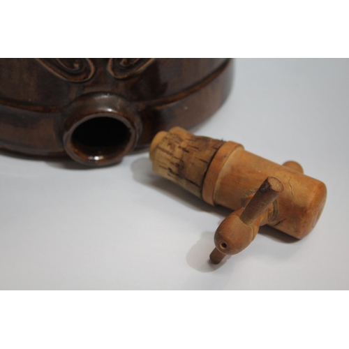 55 - A PAIR OF CERAMIC WINE DISPENSERS, each with a wooden tap and cork seal, and lift top lids; floral e... 