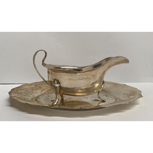 56 - A SILVER AND SILVER PLATED LOT TO INCLUDE (i) A silver sauce boat, Maker Viner's Ltd (Emile Viner), ... 