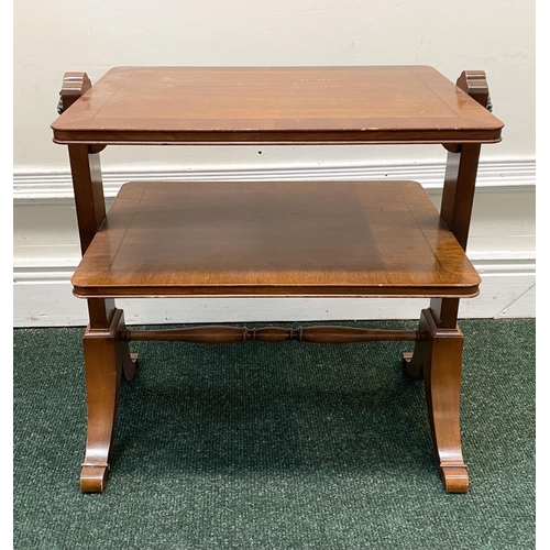 60 - A MAHOGANY CROSSBANDED TWO TIER SIDE TABLE, fluted side supports with brass lion handles, turned cro... 