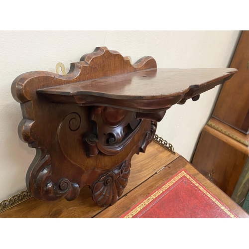 64 - A 19TH CENTURY IRISH MAHOGANY WALL BRACKET, ornately carved with shell motif, Dimensions: 34cm high ... 