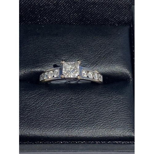 70 - A CLASSIC 18CT WHITE GOLD PRINCESS CUT DIAMOND SOLITAIRE RING, with four round brilliant cut diamond... 