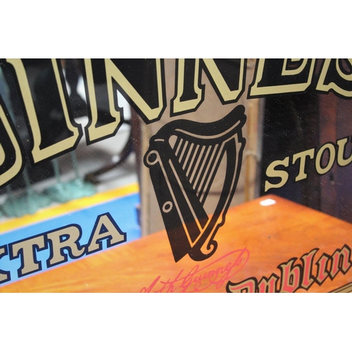 79 - A PUB GUINNESS ADVERTISEMENT MIRROR, produced c. 1990s, sat in bevelled wooden frame, 92x62x3cm,