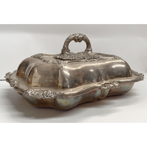 92 - A PAIR OF EARLY 20TH CENTURY SILVER PLATED ENTRÉE DISHES, finely decorated with scroll shaped edge a... 