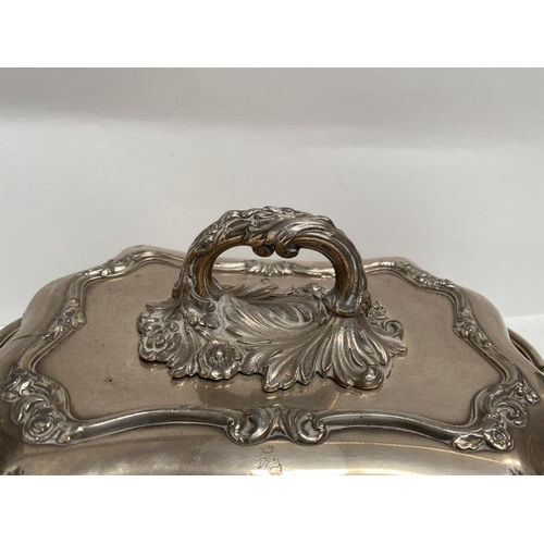 92 - A PAIR OF EARLY 20TH CENTURY SILVER PLATED ENTRÉE DISHES, finely decorated with scroll shaped edge a... 