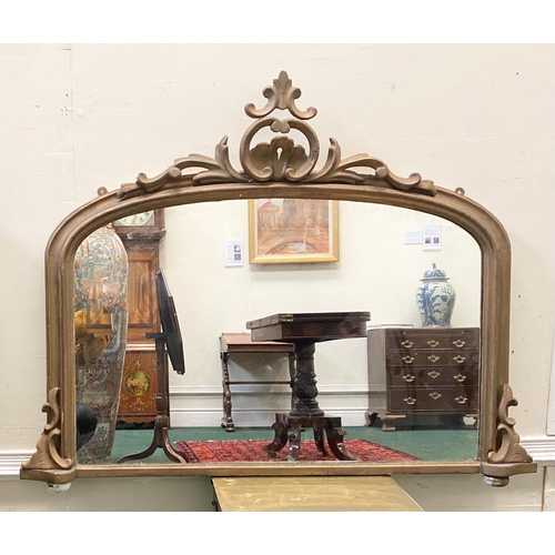 95 - AN IRISH 19TH CENTURY GILT OVERMANTLE MIRROR, with ornate frame of arched form, crested scroll to to... 