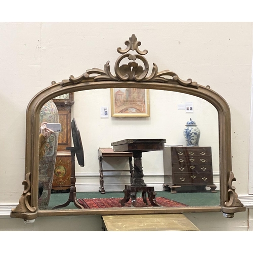 95 - AN IRISH 19TH CENTURY GILT OVERMANTLE MIRROR, with ornate frame of arched form, crested scroll to to... 