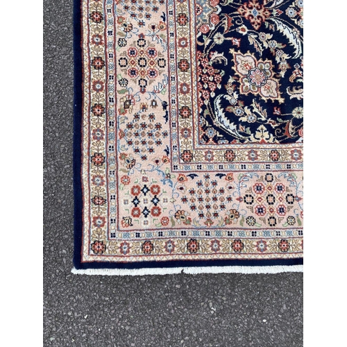 1 - A PERSIAN TABRIZ RUG, material: hand spun wool with natural organic dyes; design: this rug features ... 