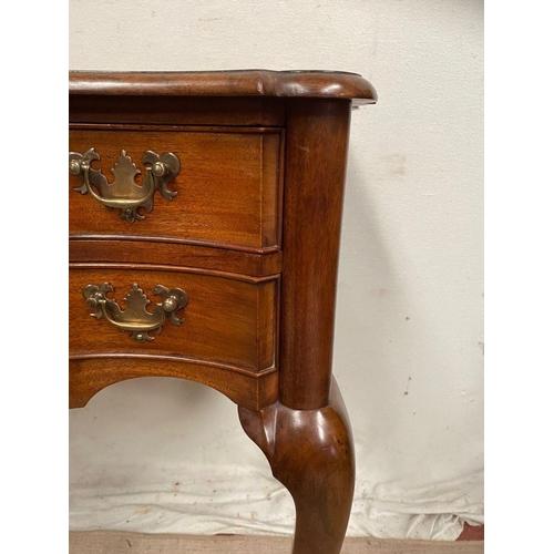 10 - A QUEEN ANNE STYLE WALNUT DESK, serpentine front with two drawers having brass handles, supported by... 