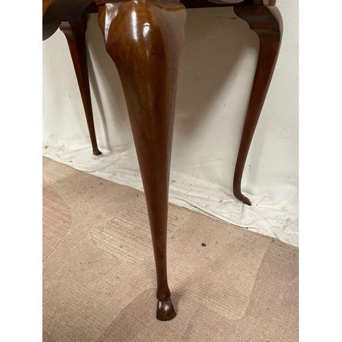 10 - A QUEEN ANNE STYLE WALNUT DESK, serpentine front with two drawers having brass handles, supported by... 