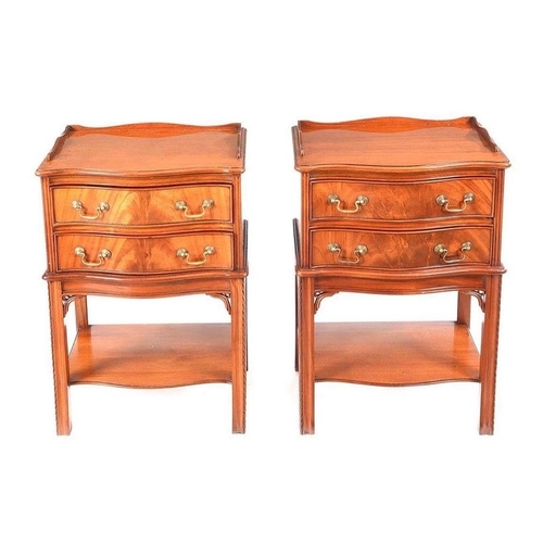 107 - A FINE PAIR OF MAHOGANY SERPENTINE SHAPED TWO DRAWER BEDSIDE PEDESTALS / SIDE CABINETS, each with a ... 