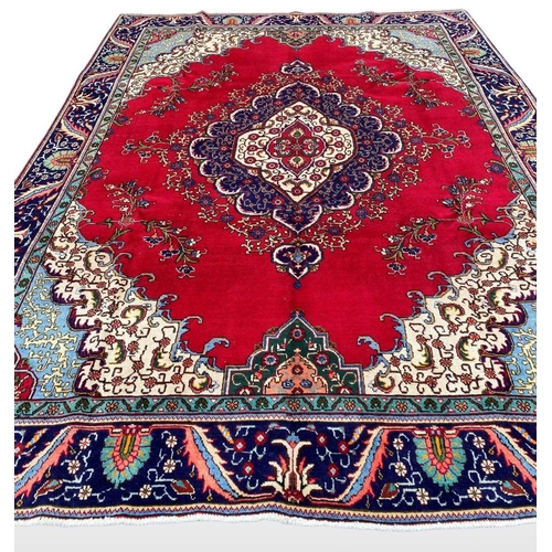 11 - A PERSIAN TABRIZ RUG, material: hand spun wool with natural organic dyes; design: this rug features ... 