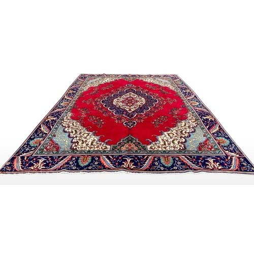 11 - A PERSIAN TABRIZ RUG, material: hand spun wool with natural organic dyes; design: this rug features ... 