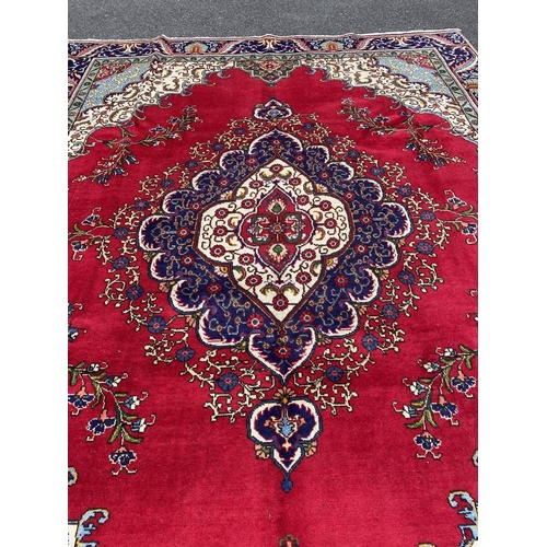 11 - A PERSIAN TABRIZ RUG, material: hand spun wool with natural organic dyes; design: this rug features ... 