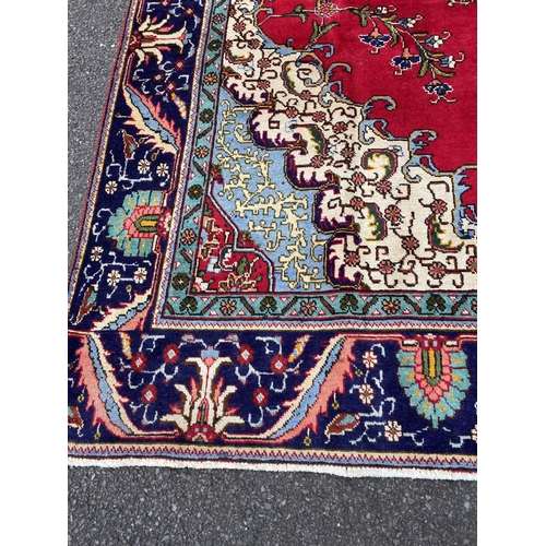 11 - A PERSIAN TABRIZ RUG, material: hand spun wool with natural organic dyes; design: this rug features ... 