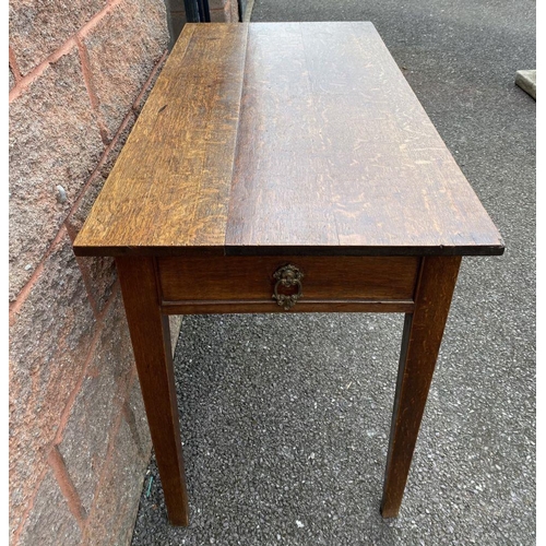 117 - AN ANTIQUE MAHOGANY SIDE TABLE, drawers to either side with ornate brass handles, standing on tapere... 