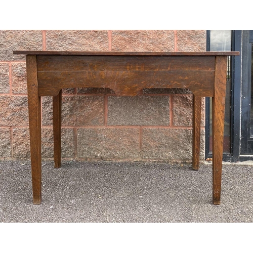 117 - AN ANTIQUE MAHOGANY SIDE TABLE, drawers to either side with ornate brass handles, standing on tapere... 