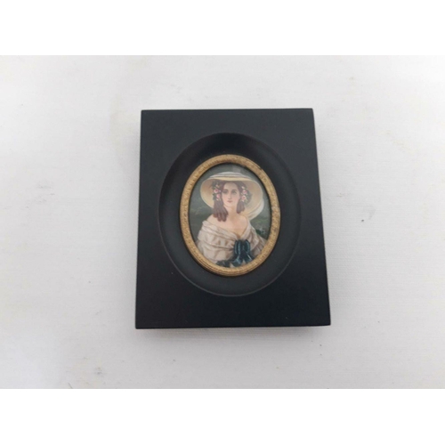 119 - AN OVAL MINIATURE PAINTING IN SQUARE FRAME, depicting seated female portrait. Dimensions: 10cm x 8cm... 