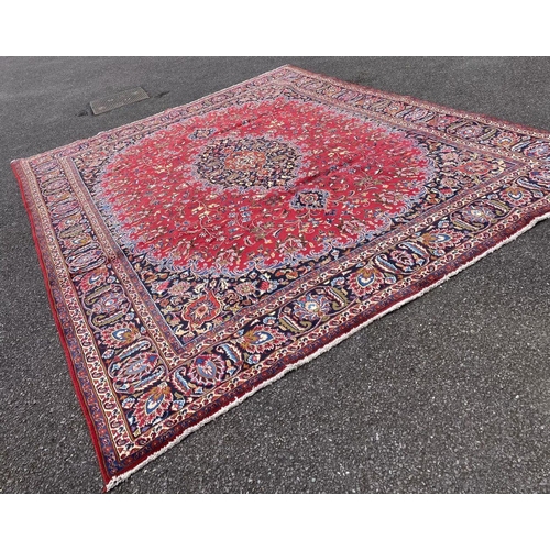 12 - A LARGE PERSIAN MASHAD RUG, material: hand spun wool with natural organic dyes; design: this rug fea... 