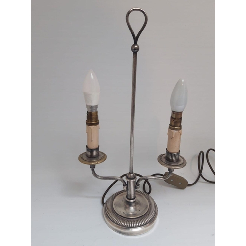 125 - A VINTAGE SILVER PLATED TWIN TABLE LAMP, two branches with electronic candlesticks, on circular flut... 