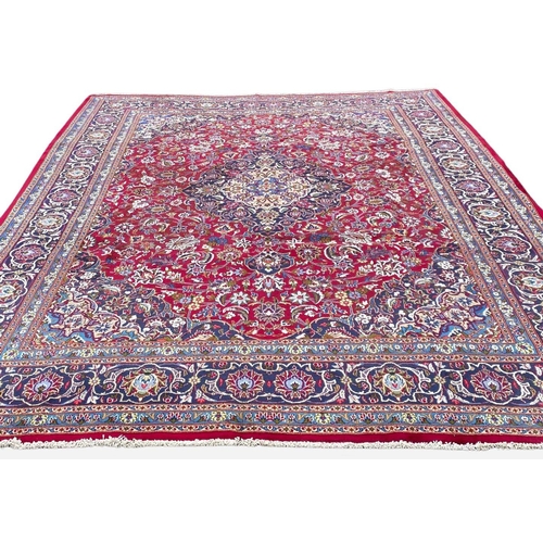 13 - A PERSIAN KASHAN RUG, material: hand spun wool with natural organic dyes; design: this rug features ... 