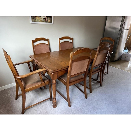 131 - A DINING ROOM SET; includes 6 chairs (4 & 2 carvers) the table is a good quality extendable table ra... 