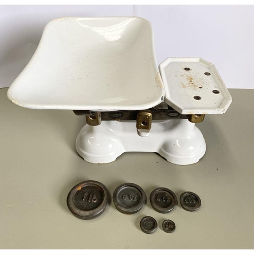 146 - A VINTAGE PAIR OF WHITE ENAMEL CAST IRON WEIGHING SCALES, complete with weights: 1lb, 8oz, 4oz, 2oz,... 