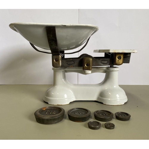 146 - A VINTAGE PAIR OF WHITE ENAMEL CAST IRON WEIGHING SCALES, complete with weights: 1lb, 8oz, 4oz, 2oz,... 