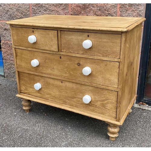 149 - A VICTORIAN PINE CHEST OF DRAWERS, two over three drawers, with porcelain handles, standing on short... 