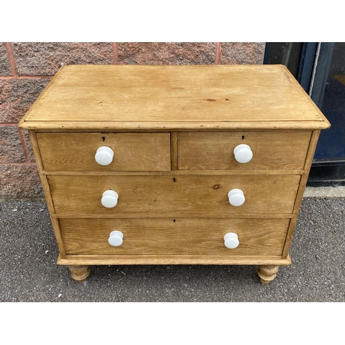 149 - A VICTORIAN PINE CHEST OF DRAWERS, two over three drawers, with porcelain handles, standing on short... 