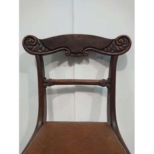 156 - AN EDWARDIAN MAHOGANY DINING CHAIR with rosewood veneer on top-rail, with each shoulder terminating ... 